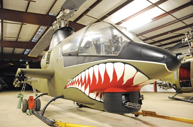 Vietnam era AH-1 Cobra exhibit inside the U.S. Army Aviation Museum.